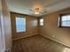 Carpeted bedroom with two windows and neutral walls at 8683 Bella Jewel Ave, Las Vegas, NV 89178