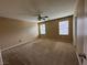 Spacious carpeted bedroom with neutral walls, ceiling fan and natural light at 8683 Bella Jewel Ave, Las Vegas, NV 89178