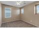 Empty bedroom showcasing carpeted floors, a ceiling fan, and natural light at 8683 Bella Jewel Ave, Las Vegas, NV 89178