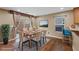 Bright dining area featuring wood-style flooring and backyard access at 8683 Bella Jewel Ave, Las Vegas, NV 89178