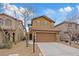 Charming two-story home with a tile roof, desert landscaping, and an attached two-car garage at 8683 Bella Jewel Ave, Las Vegas, NV 89178