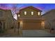 Beautiful two-story home with a tile roof and two-car garage is captured at sunset at 8683 Bella Jewel Ave, Las Vegas, NV 89178