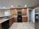 Functional kitchen featuring granite countertops, stainless steel appliances, and ample cabinet space at 8683 Bella Jewel Ave, Las Vegas, NV 89178