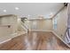 Spacious living room with wood-style flooring and staircase at 8683 Bella Jewel Ave, Las Vegas, NV 89178