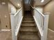 Carpeted staircase with white railing leading to the second floor at 8683 Bella Jewel Ave, Las Vegas, NV 89178