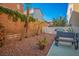 The backyard featuring a patio, desert landscaping, and privacy fence at 9489 Liquid Loco St, Las Vegas, NV 89178