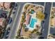 Aerial shot of community pool area featuring a lounge, landscaping, and plenty of sunlight at 9489 Liquid Loco St, Las Vegas, NV 89178