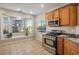 Bright eat-in kitchen with stainless steel appliances and a large window at 9489 Liquid Loco St, Las Vegas, NV 89178