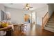 Cozy living room featuring wood floors, neutral walls, and staircase at 9489 Liquid Loco St, Las Vegas, NV 89178