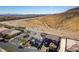 Home with desert landscape in aerial view, showcasing neighborhood and natural surroundings at 9519 Chandler Springs Ave, Las Vegas, NV 89148