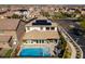 Aerial view of the home featuring a pool, outdoor seating area, and solar panels at 9519 Chandler Springs Ave, Las Vegas, NV 89148
