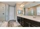 Modern primary bathroom boasting dual sinks, a soaking tub, and a separate glass shower at 9519 Chandler Springs Ave, Las Vegas, NV 89148