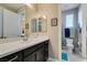 This bathroom features a spacious vanity and a well-lit mirror, creating a bright and functional space at 9519 Chandler Springs Ave, Las Vegas, NV 89148