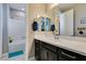 This bathroom features a shower-tub combination and a spacious vanity, making it highly functional and comfortable at 9519 Chandler Springs Ave, Las Vegas, NV 89148