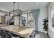 Dining area with a view of an outdoor seating area, accessible through sliding glass doors and staircase at 9519 Chandler Springs Ave, Las Vegas, NV 89148