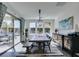 Bright dining room with an elegant table, stylish chairs, sliding glass doors to an outdoor patio at 9519 Chandler Springs Ave, Las Vegas, NV 89148