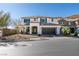 Charming two-story home features a well-manicured front yard and an attached two-car garage at 9519 Chandler Springs Ave, Las Vegas, NV 89148