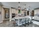 Spacious kitchen with granite countertops, stainless steel appliances, and modern lighting at 9519 Chandler Springs Ave, Las Vegas, NV 89148