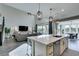 Stylish kitchen with island, granite countertops and an open concept design at 9519 Chandler Springs Ave, Las Vegas, NV 89148