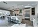 Bright kitchen featuring a large island with bar seating and stainless steel refrigerator at 9519 Chandler Springs Ave, Las Vegas, NV 89148