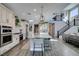 Bright and airy kitchen with stainless steel appliances and a large island with seating at 9519 Chandler Springs Ave, Las Vegas, NV 89148