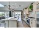 Modern kitchen featuring stainless steel appliances, center island, and ample counter space at 9519 Chandler Springs Ave, Las Vegas, NV 89148