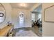 Bright entryway with modern decor, featuring a stylish console table and an open view to the living room at 9519 Chandler Springs Ave, Las Vegas, NV 89148