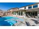 Beautiful backyard pool with attached spa and desert landscaping, perfect for outdoor entertaining at 9519 Chandler Springs Ave, Las Vegas, NV 89148