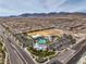 The aerial view shows a community center with a pool, playground, and sports field amidst residential neighborhoods at 9655 Shadow Cliff Ave, Las Vegas, NV 89166