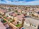 Overhead aerial view of homes with tile roofs, a pool, and manicured lawns at 9655 Shadow Cliff Ave, Las Vegas, NV 89166