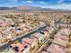 Aerial view showcasing a residential neighborhood with mountain backdrop at 9655 Shadow Cliff Ave, Las Vegas, NV 89166