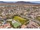 Aerial shot of neighborhood park featuring a basketball court and playground, surrounded by homes and streets at 9655 Shadow Cliff Ave, Las Vegas, NV 89166