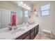 Bathroom showcasing double sinks, a large mirror, and modern fixtures at 9655 Shadow Cliff Ave, Las Vegas, NV 89166