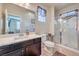 Well-lit bathroom featuring a glass shower and modern fixtures at 9655 Shadow Cliff Ave, Las Vegas, NV 89166