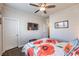 Bedroom featuring a mounted TV, modern decor, and wood-look flooring at 9655 Shadow Cliff Ave, Las Vegas, NV 89166