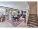 Open dining area with table, backyard view, and staircase leading to a second story at 9655 Shadow Cliff Ave, Las Vegas, NV 89166