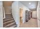 Hallway near stairs with tile floors and glass display cases at 9655 Shadow Cliff Ave, Las Vegas, NV 89166