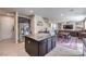 Open concept kitchen featuring stainless steel appliances and connecting to the living room at 9655 Shadow Cliff Ave, Las Vegas, NV 89166