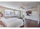 Bright main bedroom featuring multiple windows and modern fixtures at 9655 Shadow Cliff Ave, Las Vegas, NV 89166