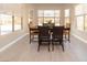 Inviting dining area with lots of light, tiled floors, and ample seating for gatherings at 967 Buggy Whip Ct, Mesquite, NV 89034