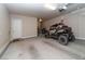 Spacious garage with an exterior door, and a large vehicle parked inside at 967 Buggy Whip Ct, Mesquite, NV 89034