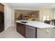 Well-lit kitchen featuring a large island, stainless steel appliances, and seamless flow to the dining area at 967 Buggy Whip Ct, Mesquite, NV 89034