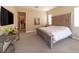 Spacious bedroom with large windows, carpeted floor, and soothing decor at 967 Buggy Whip Ct, Mesquite, NV 89034