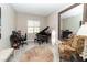 Home office features a grand piano, floral armchair, and a large mirror, perfect for creative work at 967 Buggy Whip Ct, Mesquite, NV 89034