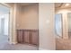 Hallway featuring a built-in cabinet, carpeted floors and doorways to other rooms at 9870 Giant Steps Ct, Las Vegas, NV 89141