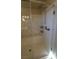 Walk-in shower featuring tiled walls, shower head, and built-in shelves at 9870 Giant Steps Ct, Las Vegas, NV 89141