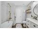 Bright bathroom features marble tiled shower, white vanity, and modern fixtures at 9972 Trailing Vine St, Las Vegas, NV 89183