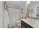 Cozy bathroom featuring a shower and a dark vanity at 9972 Trailing Vine St, Las Vegas, NV 89183