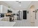 Modern kitchen with stainless steel appliances, white cabinetry, and an open layout at 9972 Trailing Vine St, Las Vegas, NV 89183