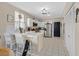 Well-lit kitchen featuring white cabinets, stainless steel appliances, and tiled flooring at 9972 Trailing Vine St, Las Vegas, NV 89183